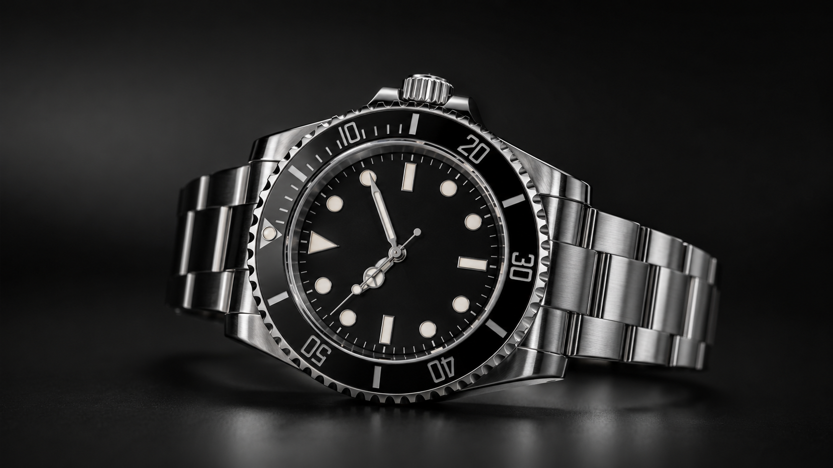 Black Ceramic Automatic Dive Watch - Replica Rolex|Fake Rolex|the best rolex watch factory - Replica Rolex|Fake Rolex|the best rolex watch factory Close-up of a stainless steel diver's watch with a black dial and rotating bezel resting on a dark surface.