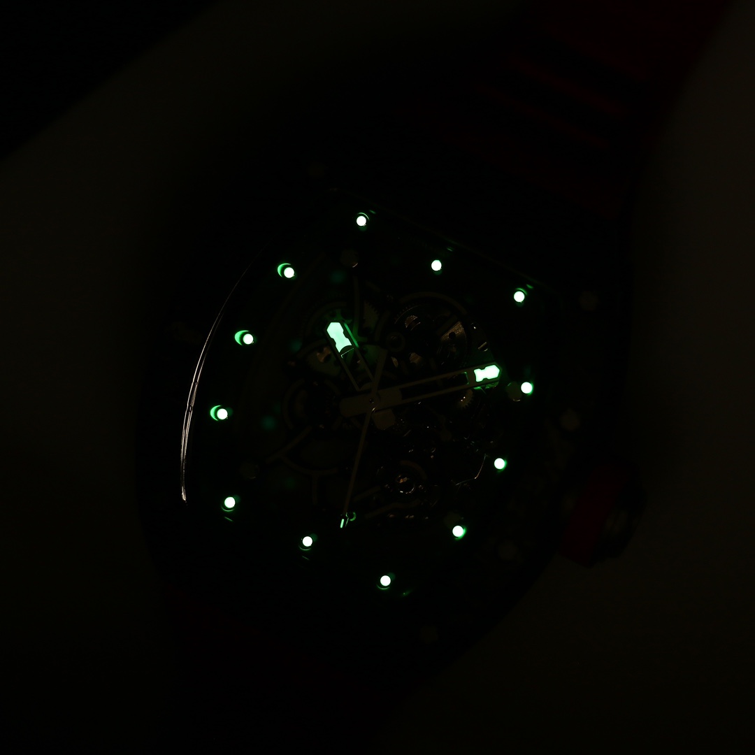 5 - Replica Rolex|Fake Rolex|the best rolex watch factory Dark image of a wristwatch face with glowing green hour markers and hands visible in low light.