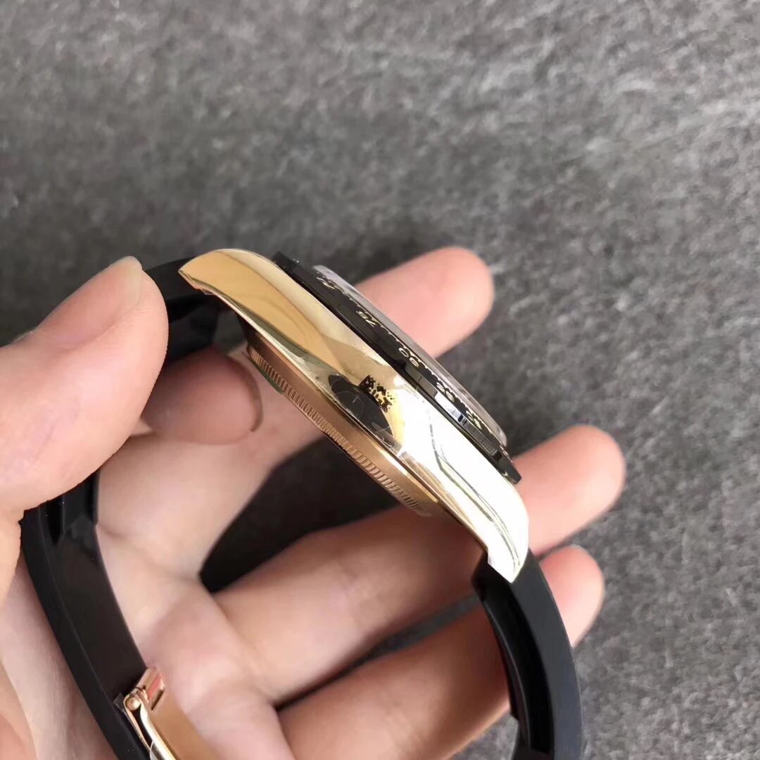 6 - Replica Rolex|Fake Rolex|the best rolex watch factory Close-up of a two-tone wristwatch with a gold case and black strap held in hand.